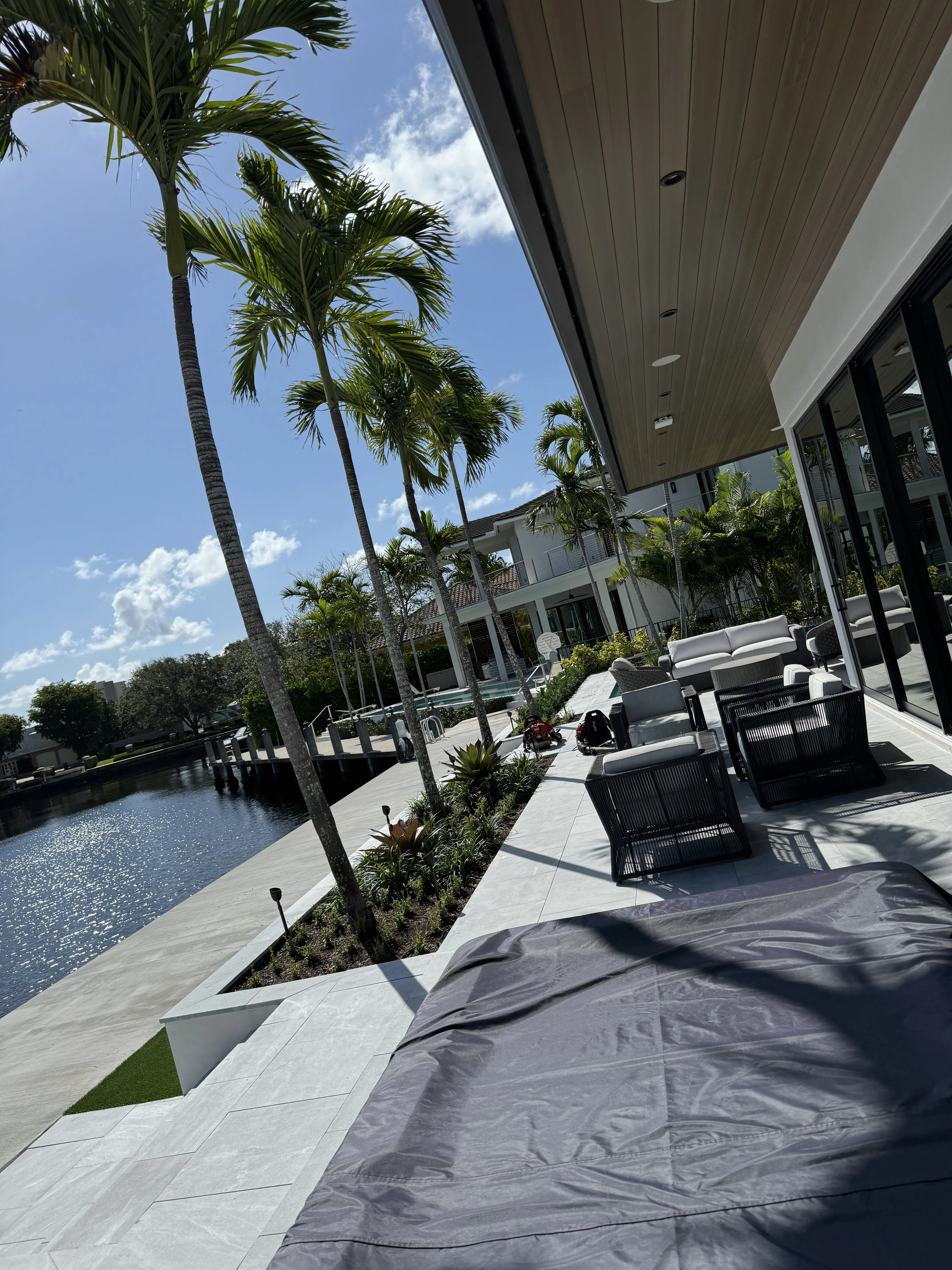 Manicured waterfront landscaping on a Pompano Beach property