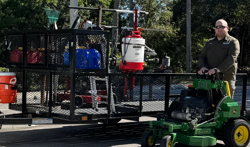 One Call Groundworks crew loading lawn and fertilization equipment